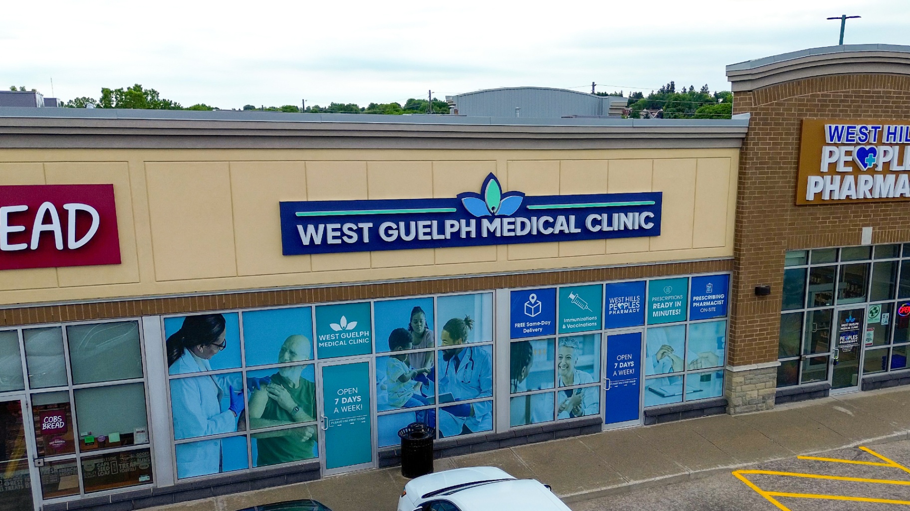 Close view of the West Guelph Medical Clinic exterior signage and window graphics