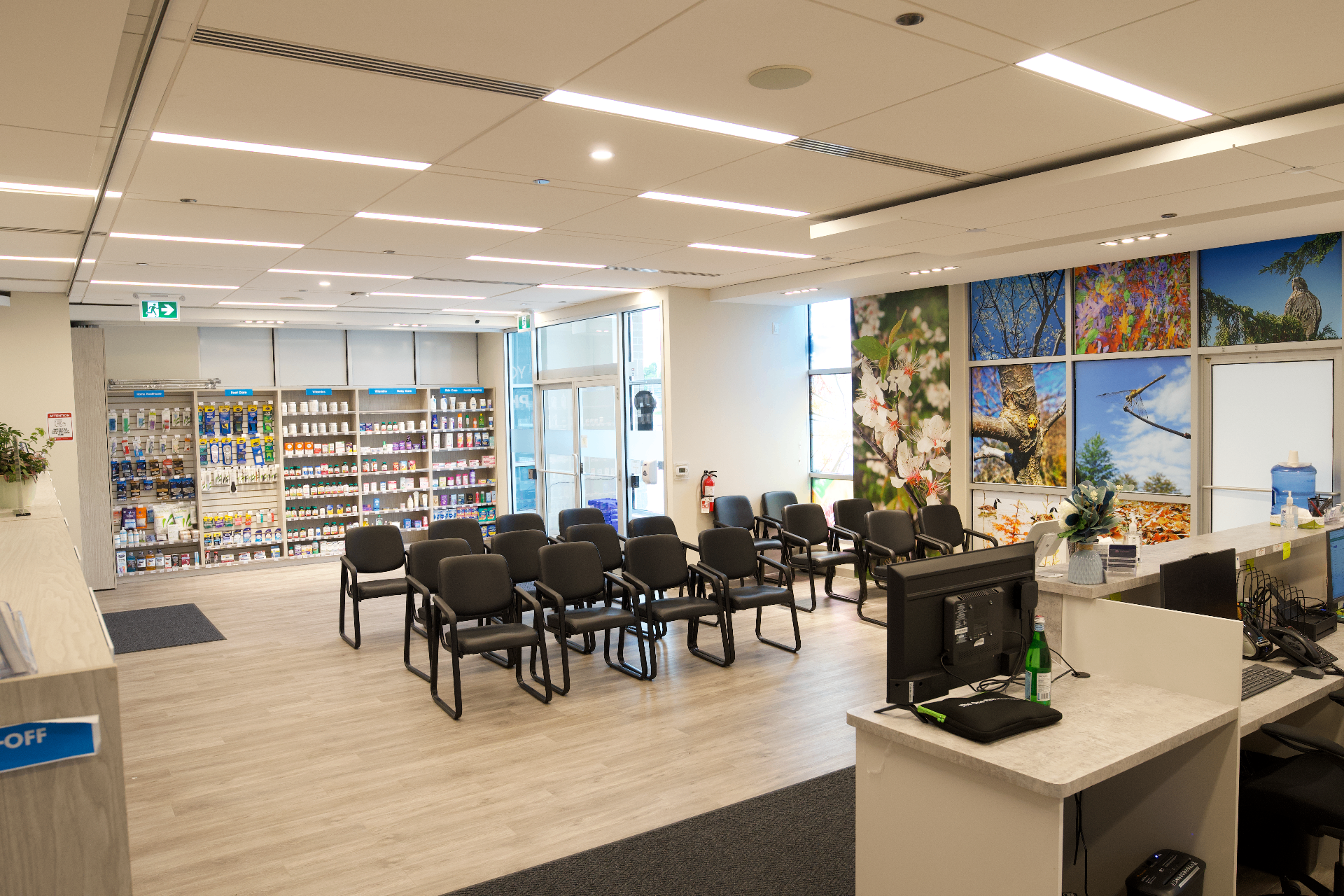 Waiting area with rows of seating, natural light and nature photography on the walls